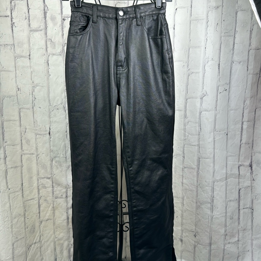 PrettyLittleThing Black Coated Denim Split Hem Flared Jeans Hi-Rise